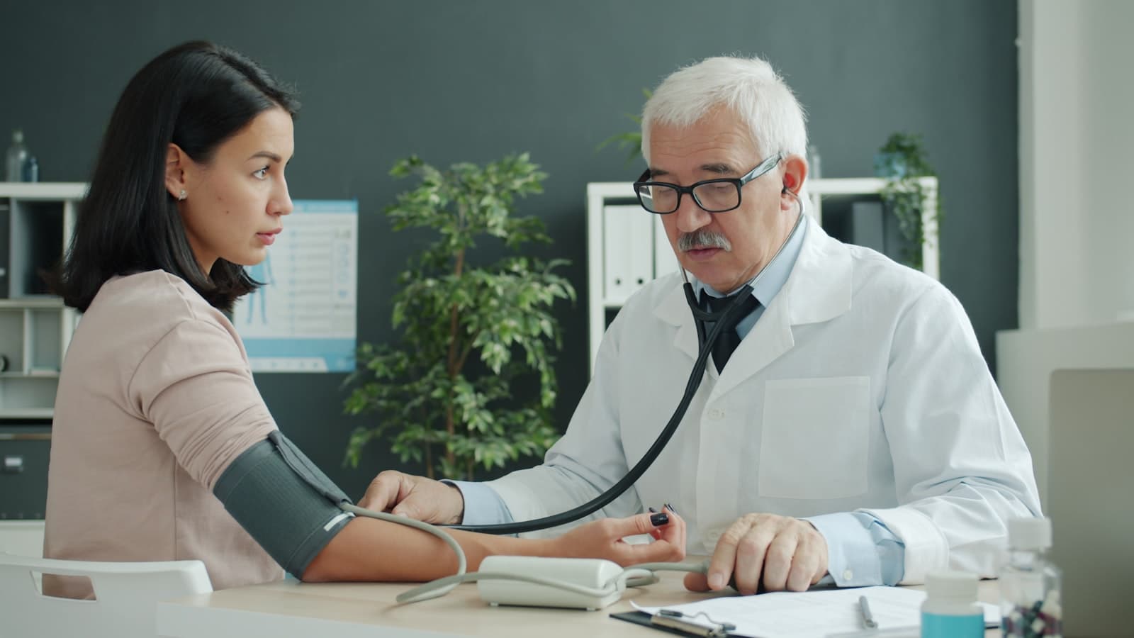 A doctor conducting a medical examination with a patient