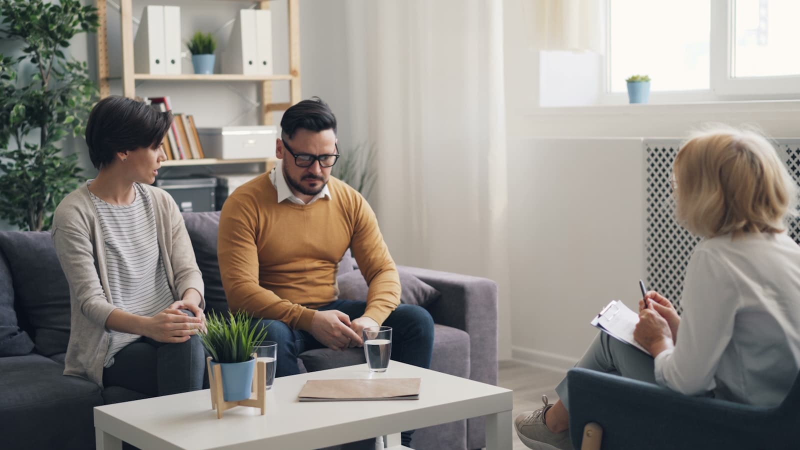 Parents in a counselling conversation with an admissions advisor