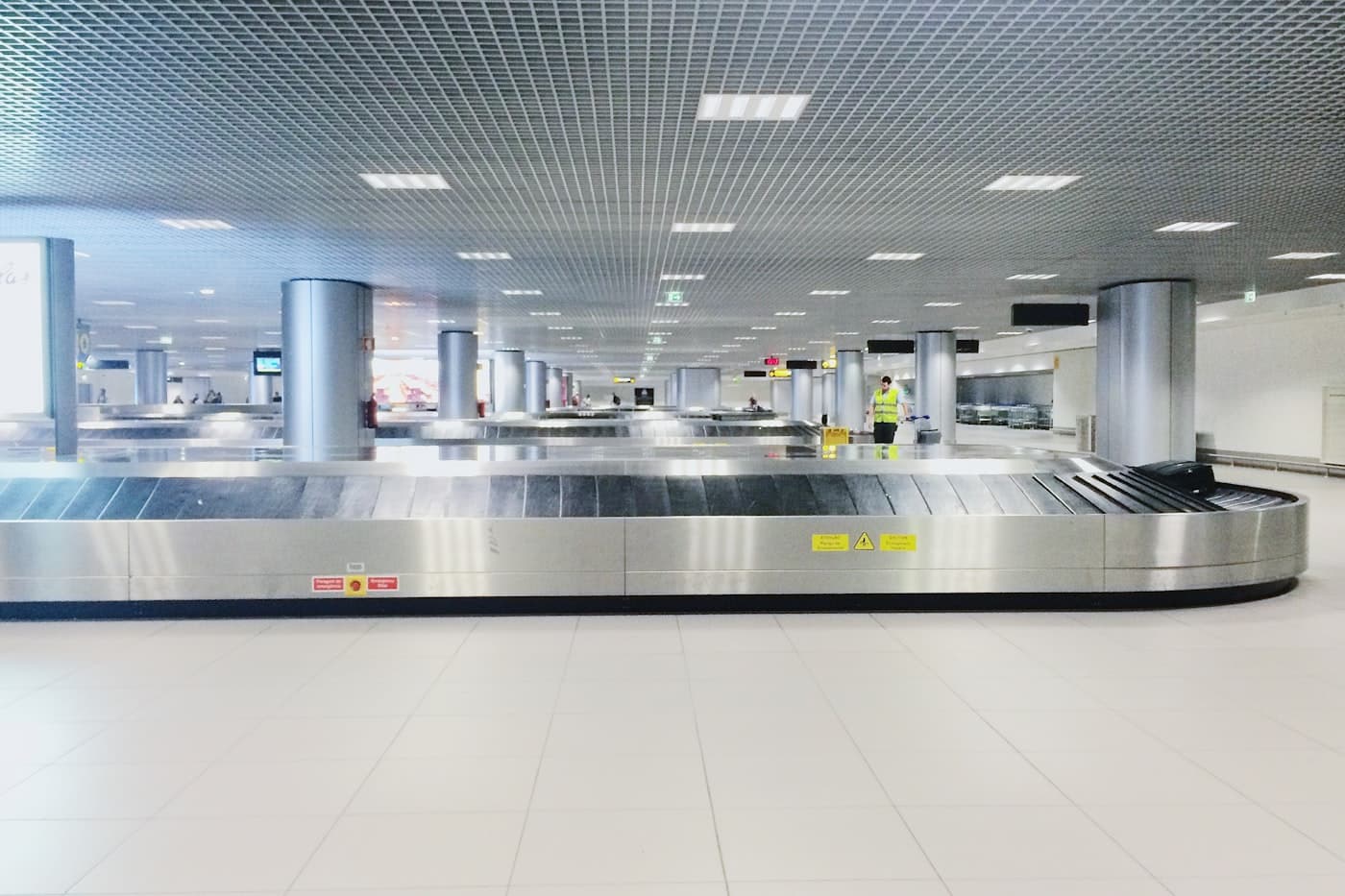An empty airport baggage claim hall